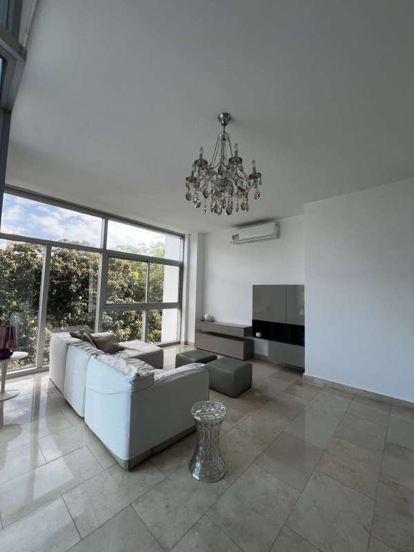 Modern dining with spiral staircase in loft apartment PH The Bridge Amador