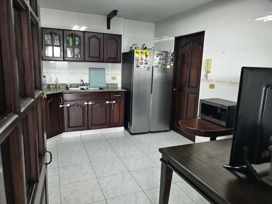 Modern bathroom with granite sink and tiled walls at PH San Francisco Panama
