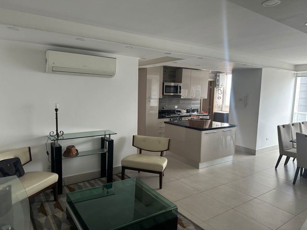 Formal dining space with large windows and city skyline view at PH Park City in Obarrio Panama