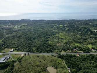 Expansive undeveloped rural land with highway and river borders San Carlos Panama