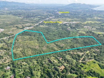 Expansive greenery coastal countryside with highway access at San José San Carlos along Pan-American Highway