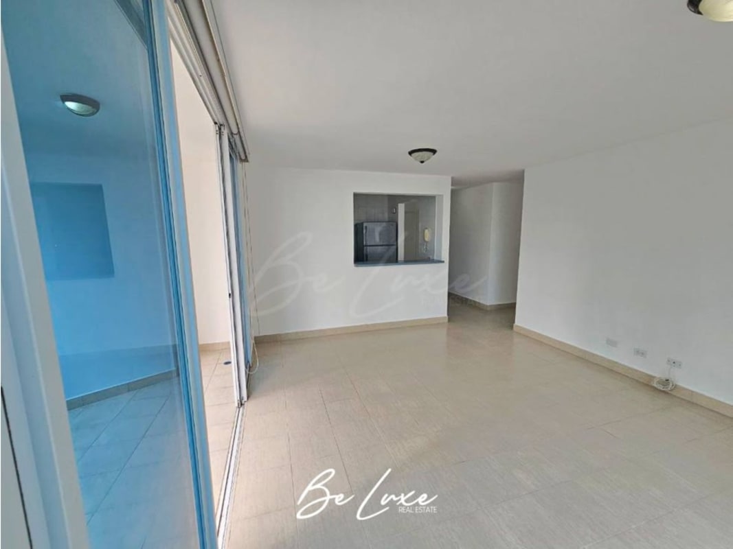 Spacious bedroom with large window and porcelain floors at Belview Tower Edison Park