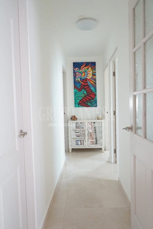 Living space with access to private balcony with greenery views in Panama City