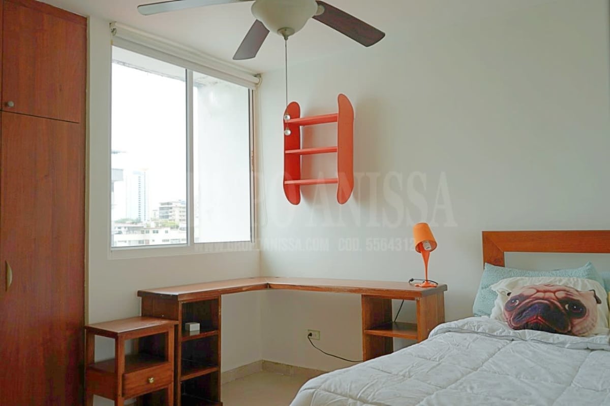Bedroom with corner desk, wardrobe, large window and city view in Panama