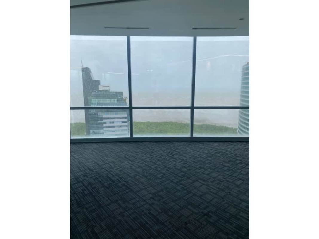 Empty glass corner office with panoramic city skyline at Costa del Este Financial Park tower