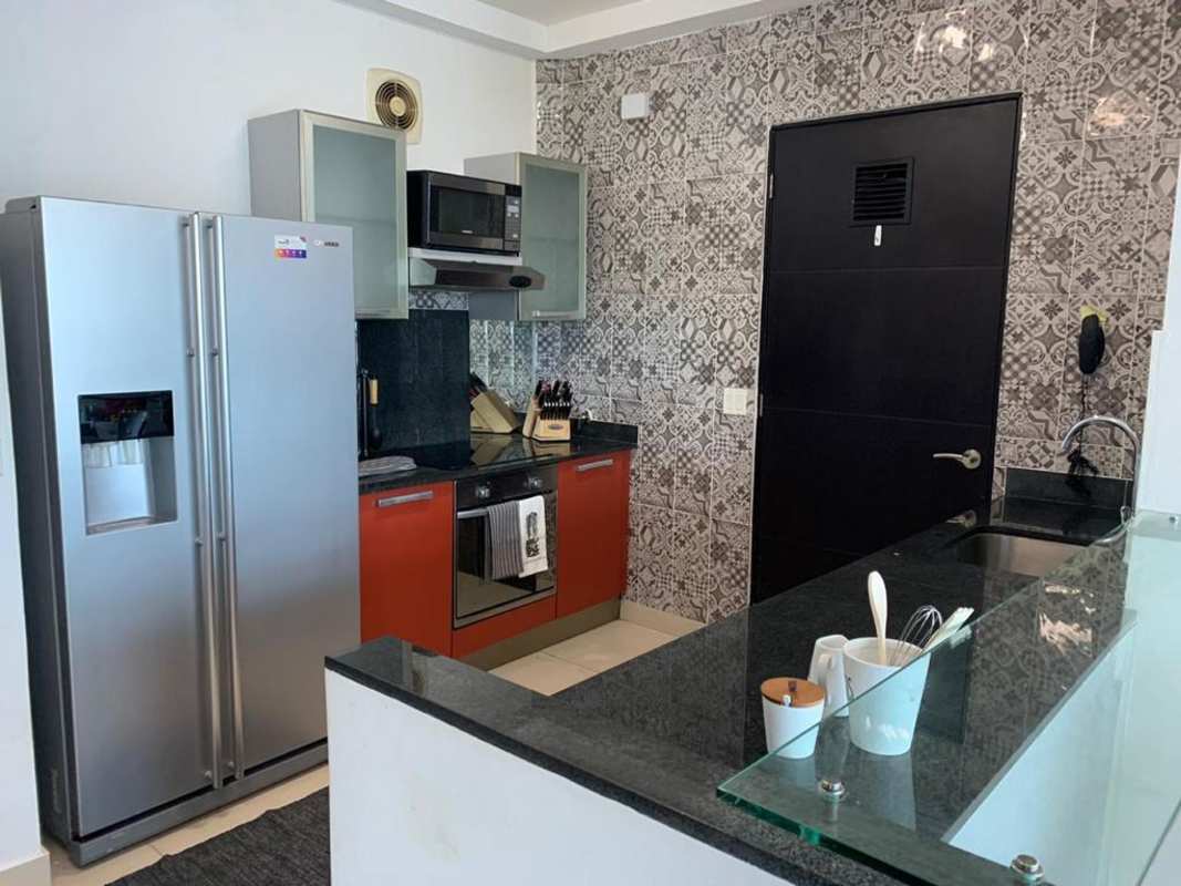 Contemporary open kitchen with granite counters, stainless appliances, breakfast bar in PH Destiny on Avenida Balboa