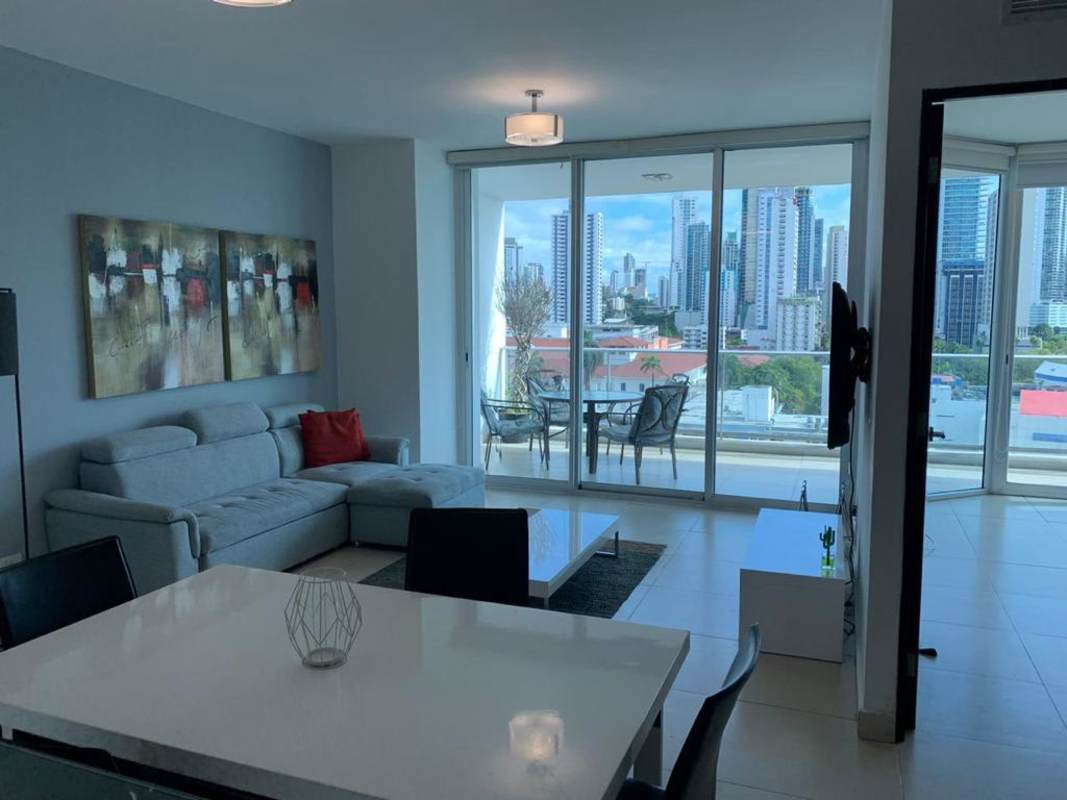 Modern open concept kitchen with breakfast bar and living space in PH Destiny Tower Panama City