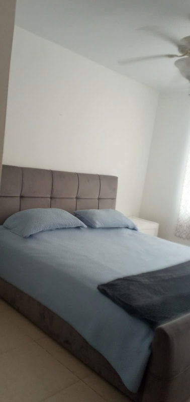 Living dining area with large windows balcony access Costa del Este condo Panama