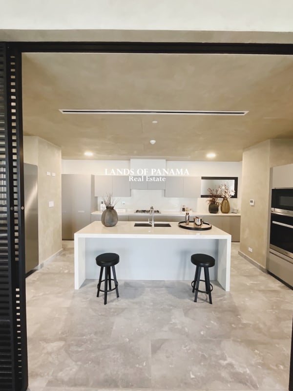 Luxury master bedroom featuring large windows with ocean view in PH Upper East Costa del Este Panama