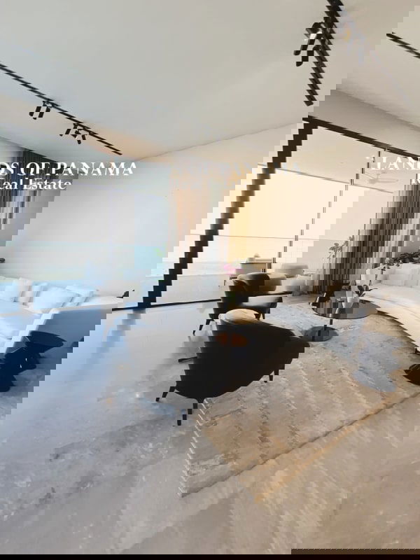 Modern kitchen with marble floors, island sink and built-in appliances in PH Upper East Costa del Este