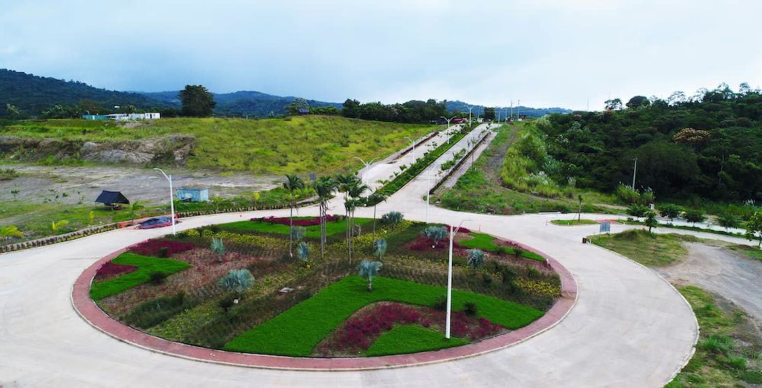 Landscaped entrance roundabout and palm-lined avenues in Green Valley development Panama
