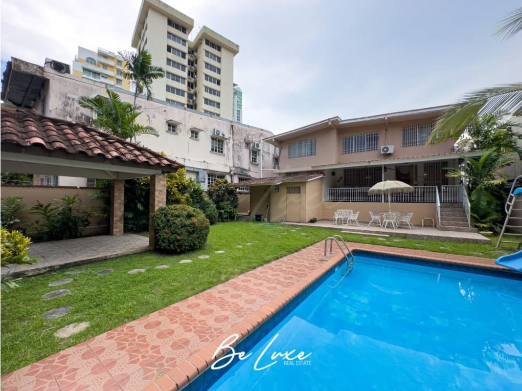 Spacious covered terrace overlooking garden and city in La Loma luxury house Panama