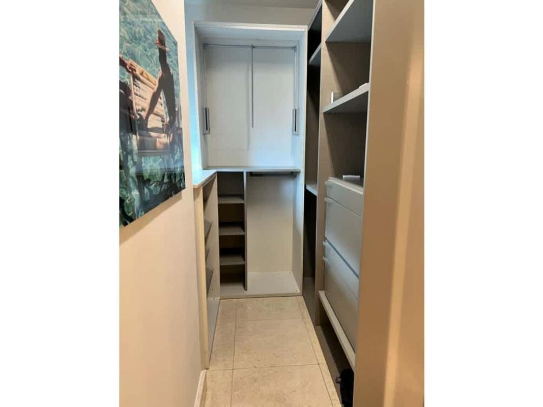 Modern kitchen with granite counters, stove, oven, and window in PH Deluxe Residence Punta Paitilla Panama