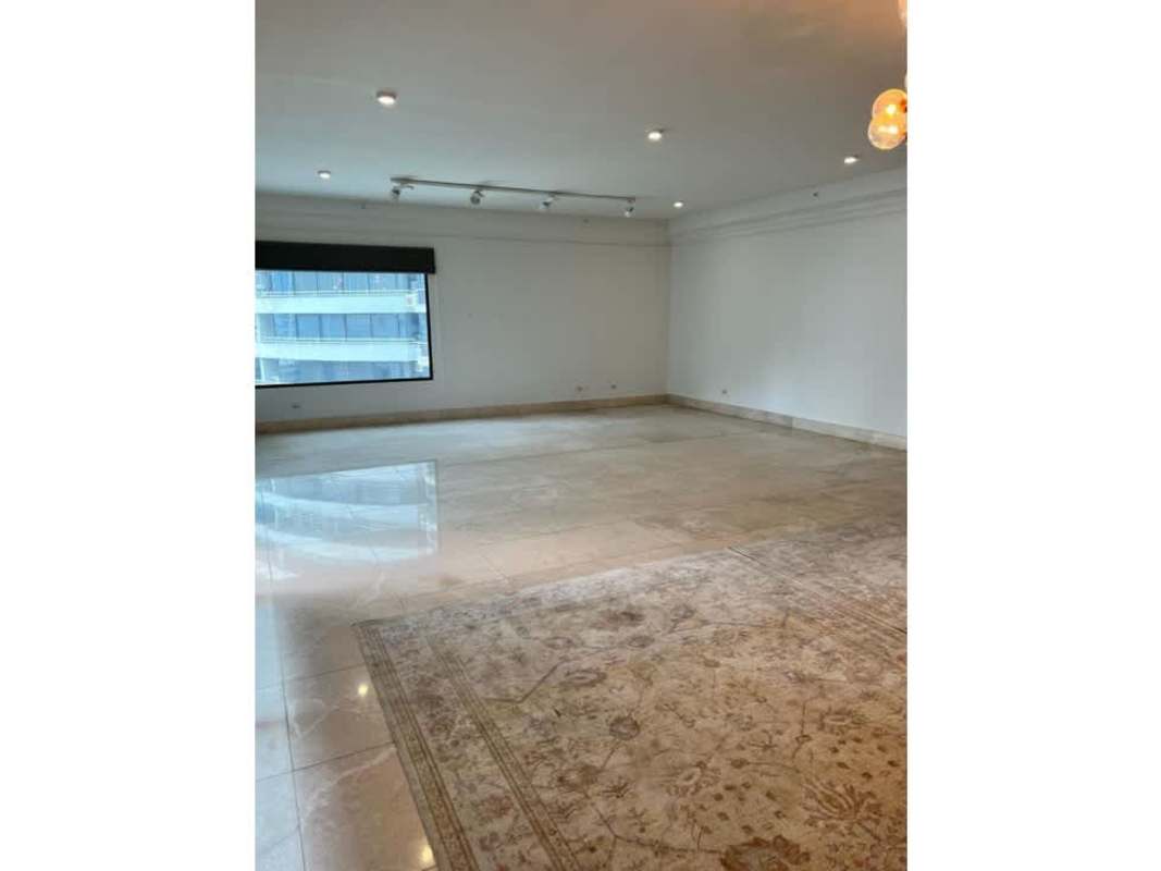 Living room with large window city views, marble floor, recessed lighting in PH Deluxe Residence Punta Paitilla Panama