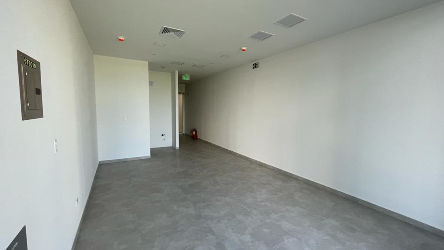 Empty hallway corridor in modern commercial medical tower Torre Arboleda Costa del Este