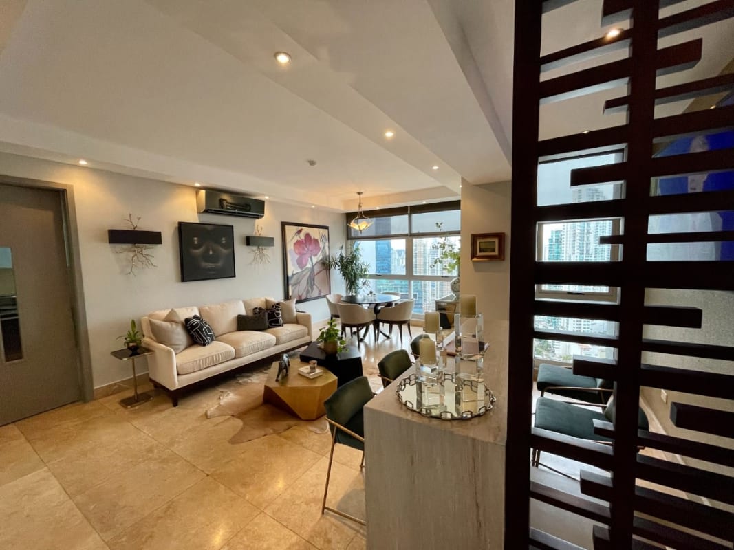 Open-concept living and dining area with marble floors, large windows, balcony ocean views PH Aquamare Panama
