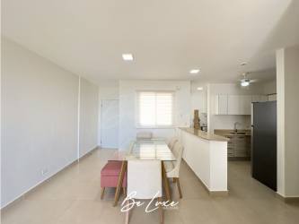 Dining space and modern kitchen with granite counters Playa Blanca condo for sale Panama