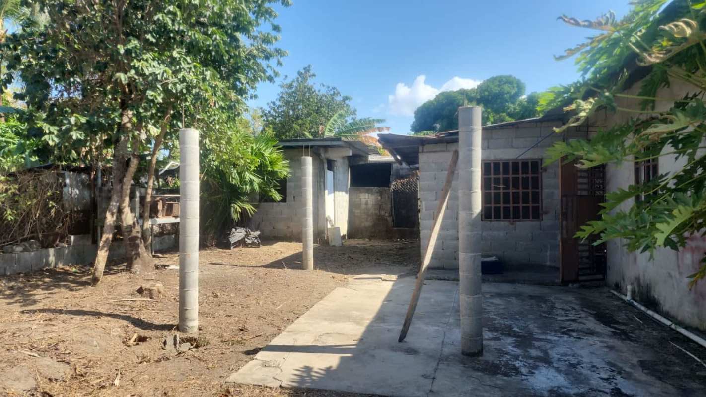 Outdoor yard space with rustic unfinished home for sale Pacora Panama