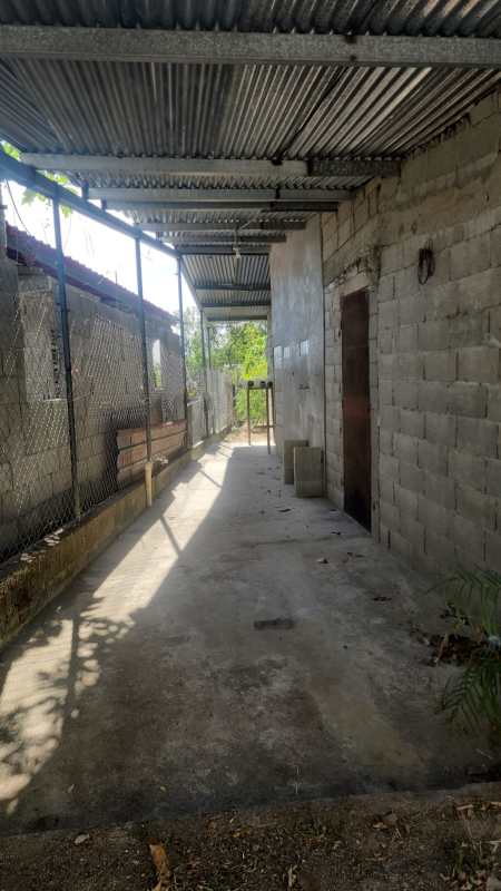 Entry porch and covered walkway at unfinished home in Pacora Panama for sale