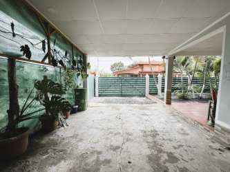 Gated parking and green yard view at Las Tablas Panama house
