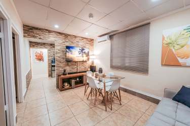 Simple bedroom with window and furnishings in Las Tablas Panama house