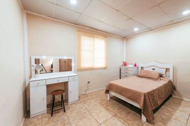 Covered patio with garden view in Las Tablas house for sale