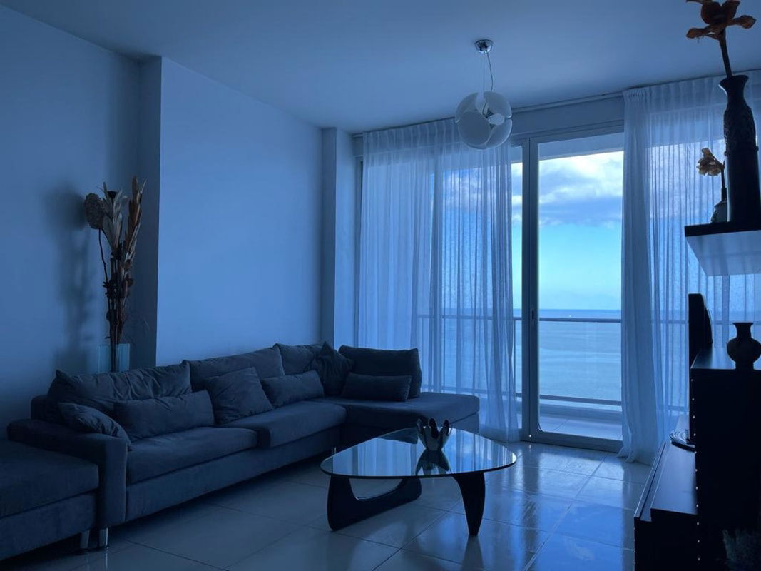 Furnished bedroom with floor-to-ceiling window and balcony access in PH Destiny Panama City