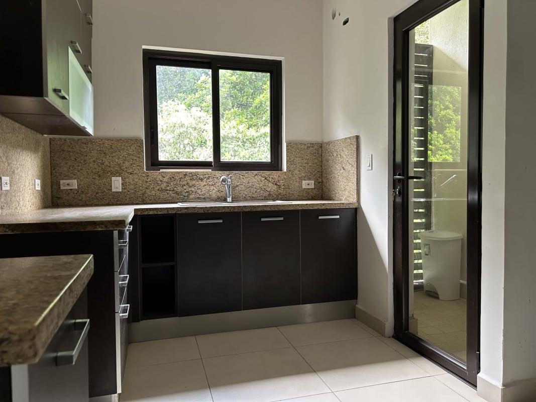 Bedroom with large window offering greenery view, white walls, star stickers in PH Embassy Village Clayton Panama