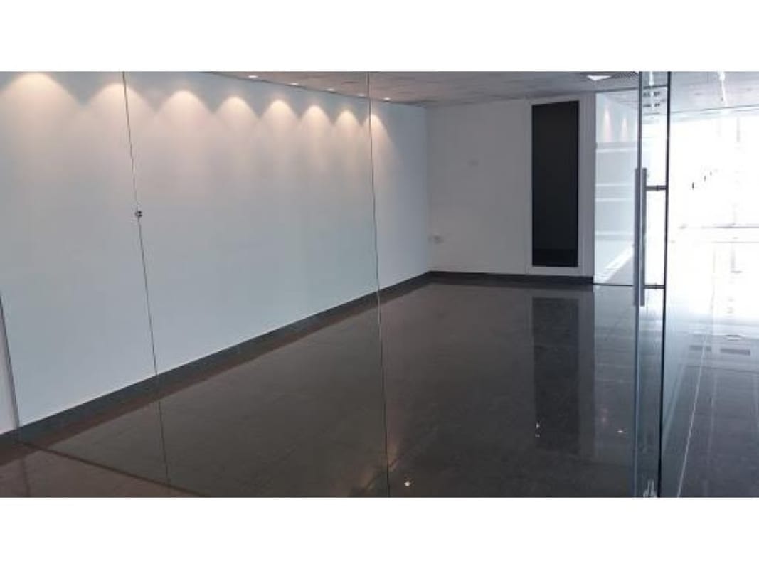 Glass walls and open office space modern commercial building Oceania Punta Pacífica Panama