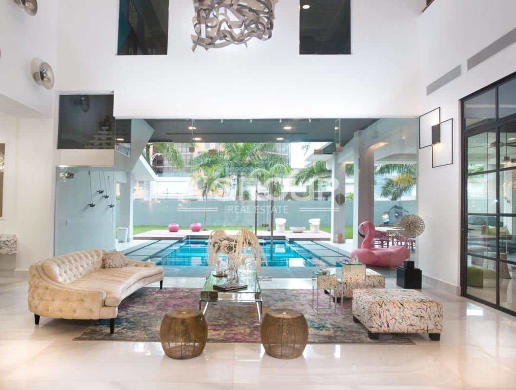 Modern dining luxury house green chairs large chandelier marble accent Costa del Este Panama