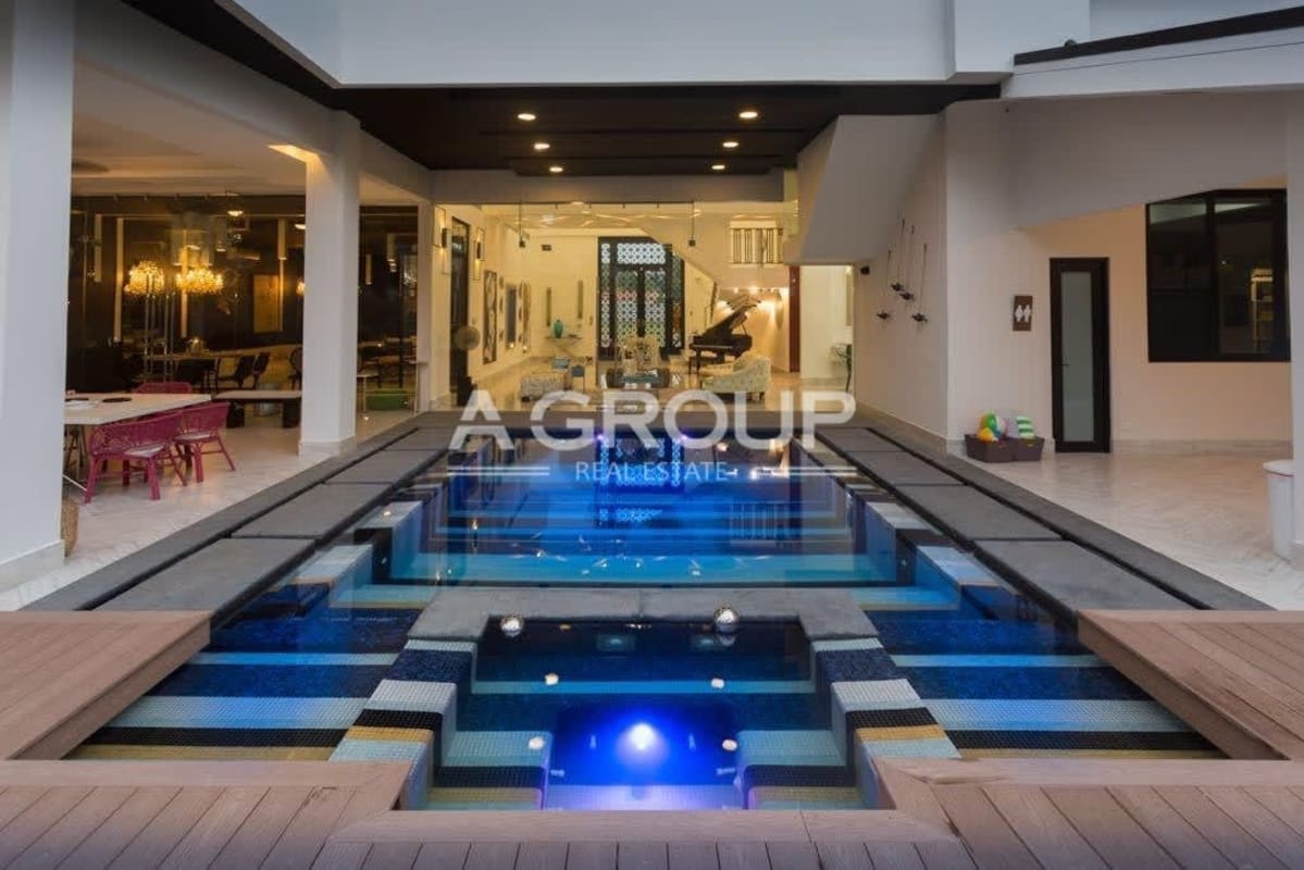 Modern home theater room recliner seats projector dark walls luxury mansion Costa del Este