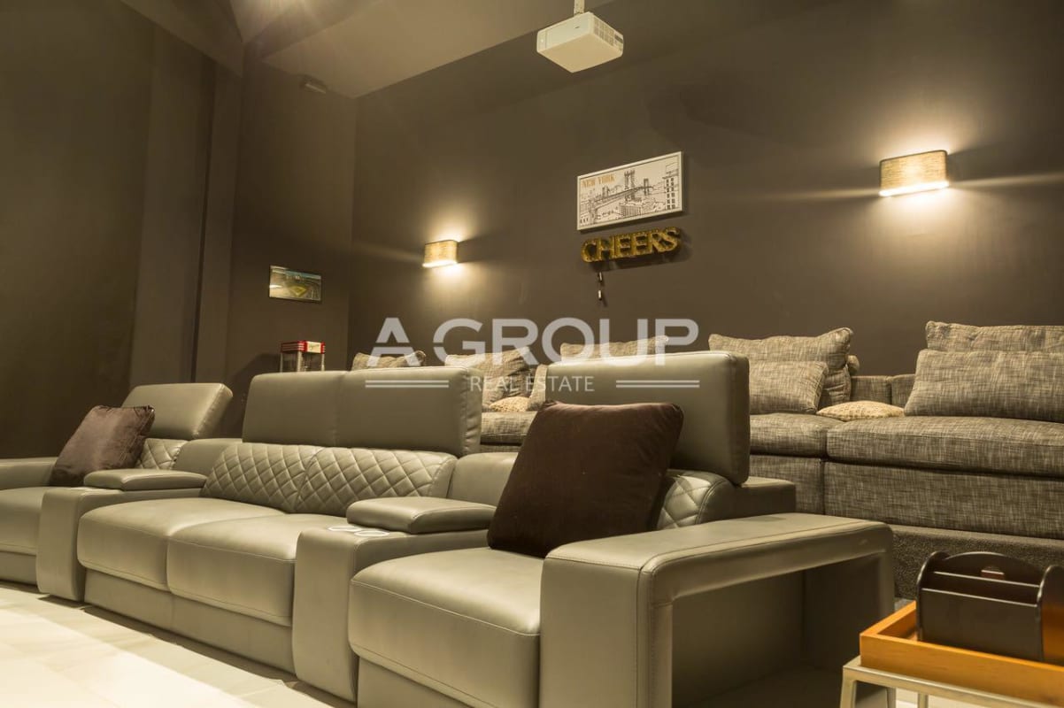 Luxury living room black walls art windows chandeliers open floor plan in Panama mansion