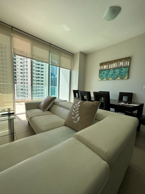 Modern living and dining room with ocean view and floor-to-ceiling windows in PH Dupont Punta Pacifica Panama