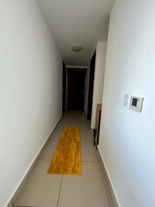 Modern apartment kitchen with granite countertops and appliances at PH Dupont Panama