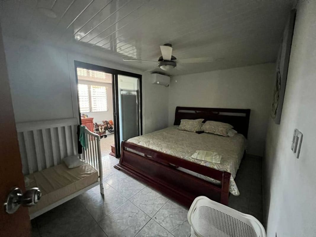 Functional tiled kitchen with appliances window and storage in Urbanización Don Bosco Panama City