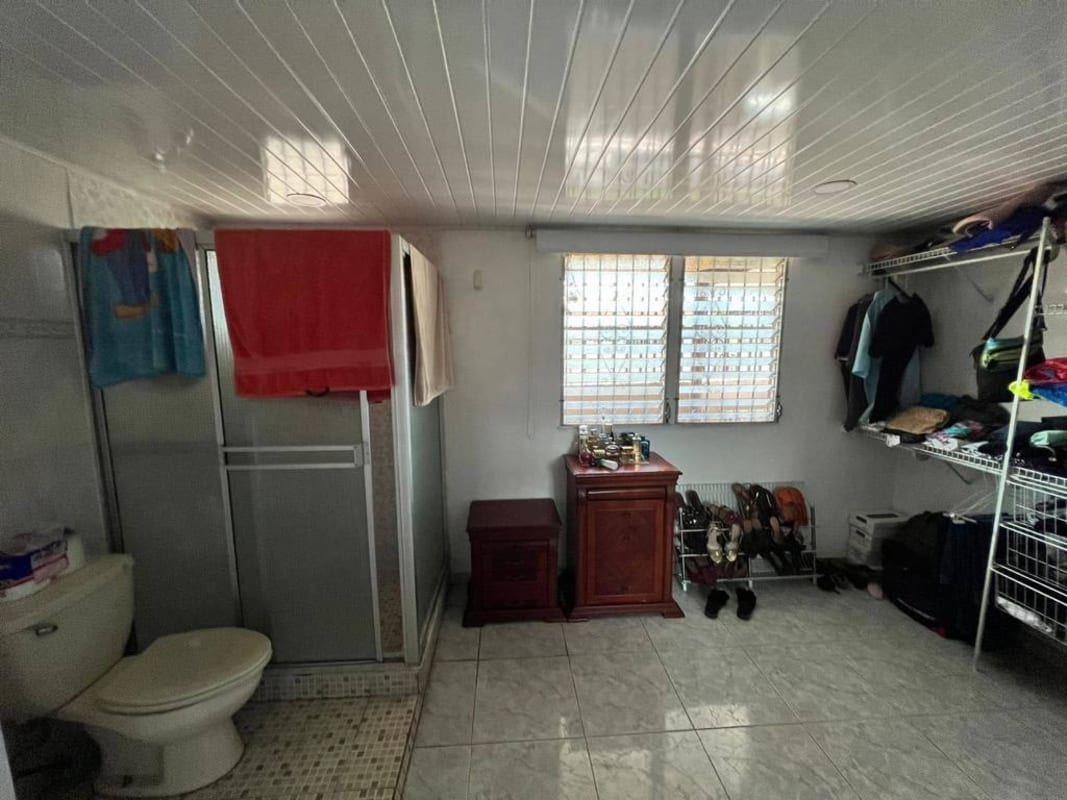 Contemporary bathroom with glass shower enclosure in Don Bosco Panama City house