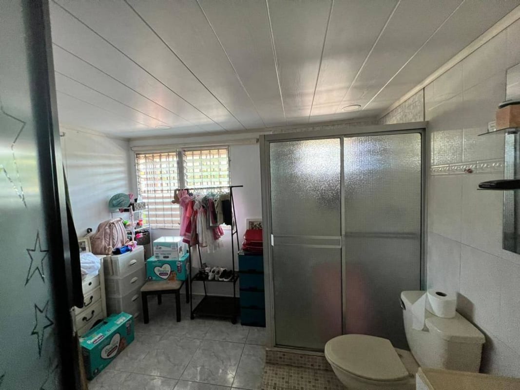 Dining room adjacent to spacious kitchen inside Panama City's Don Bosco neighborhood house for sale