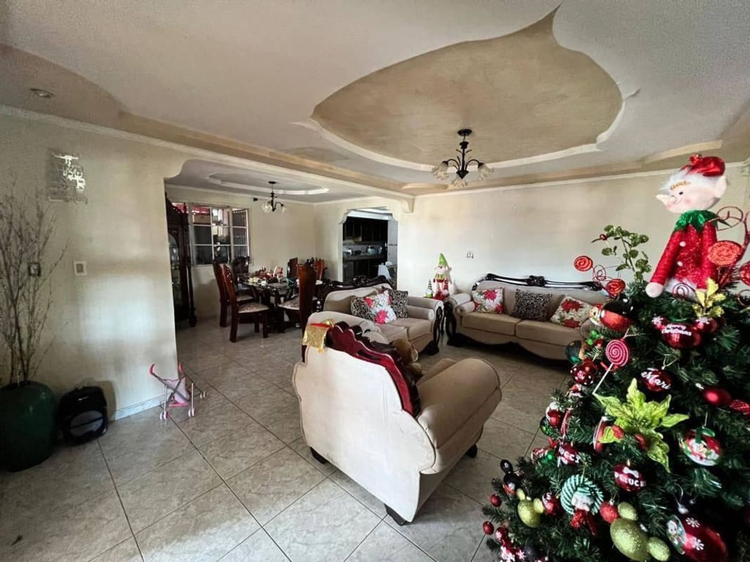 Large living and dining with festive holiday decor inside Don Bosco house Panama City