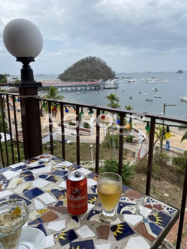 Rustic Mediterranean dining room with wooden furniture and sea views Isla Taboga Panama hotel