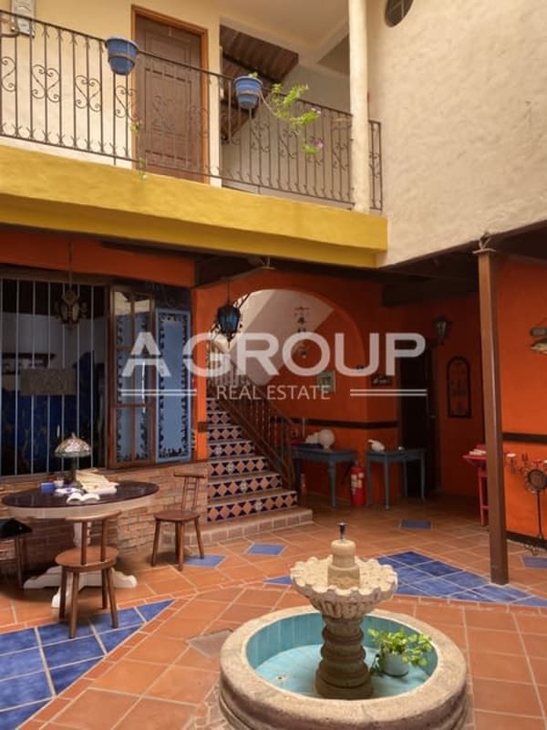 Colorful colonial-style courtyard with fountain, tile, balcony Isla Taboga Panama hotel