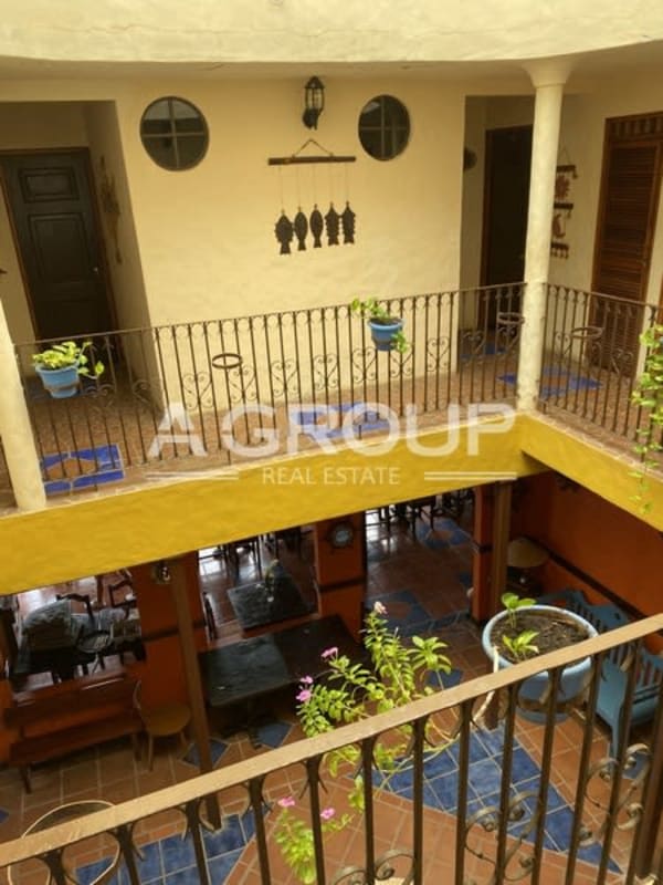 Balcony with mosaic table overlooking ocean and marina Isla Taboga Panama