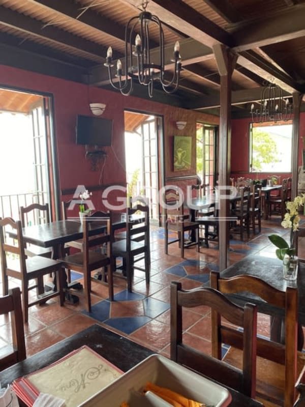 Covered terrace with ocean view and outdoor dining Isla Taboga boutique hotel Panama