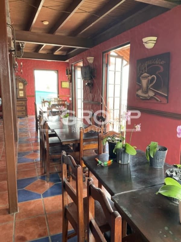 Colonial style eating area with large windows and rustic design Isla Taboga hotel Panama