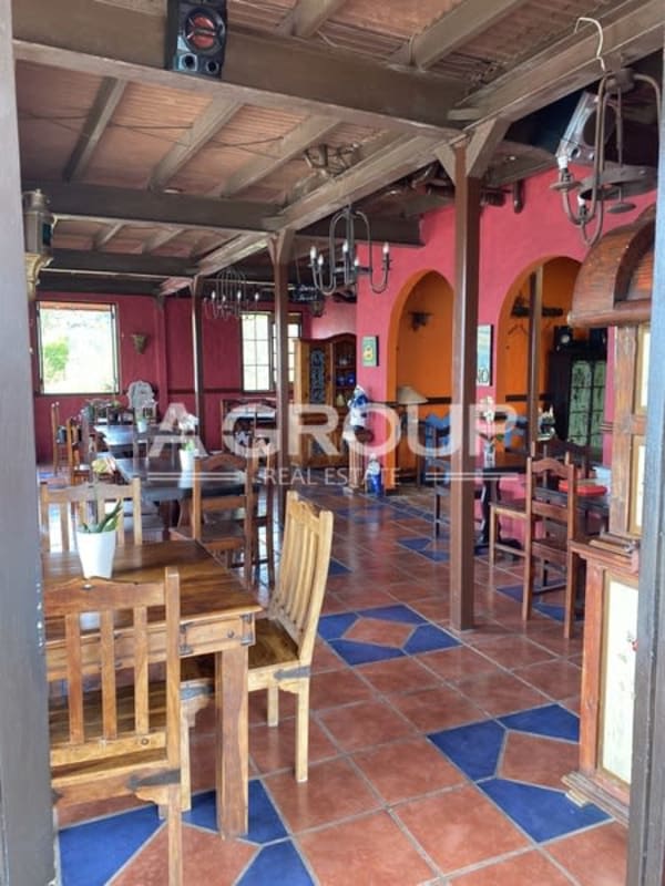 Natural wood decor dining room with large windows Isla Taboga Panama hotel