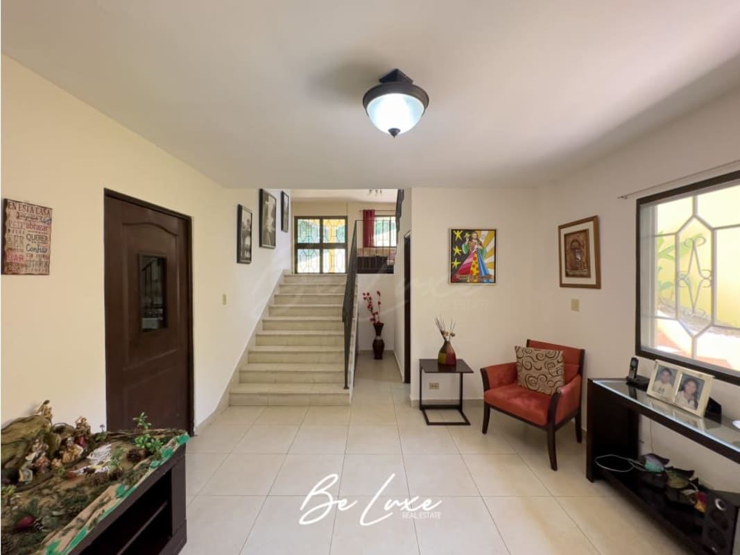 Large master bedroom with tiled floors, balcony, ensuite bathroom at Ancón house for rent