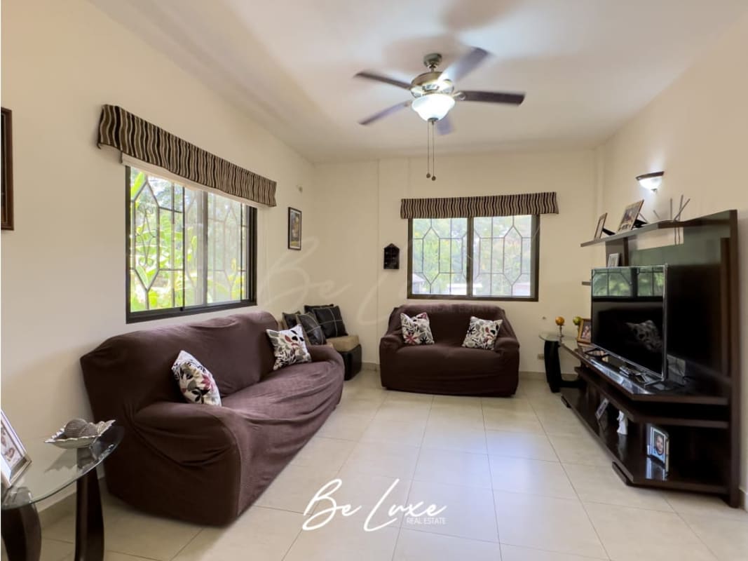 Kitchen with granite countertops, wooden cabinetry, appliances in Ancón house Panama for rent