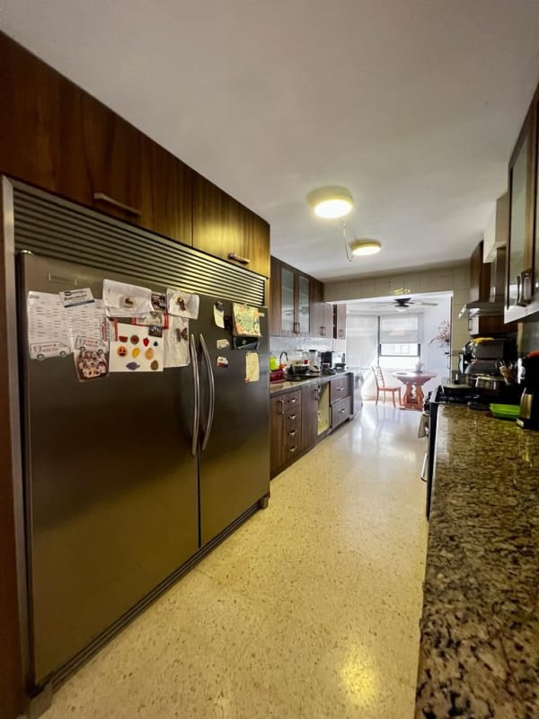 Spacious modern kitchen granite countertops wood cabinetry PH Marina del Rey Panama