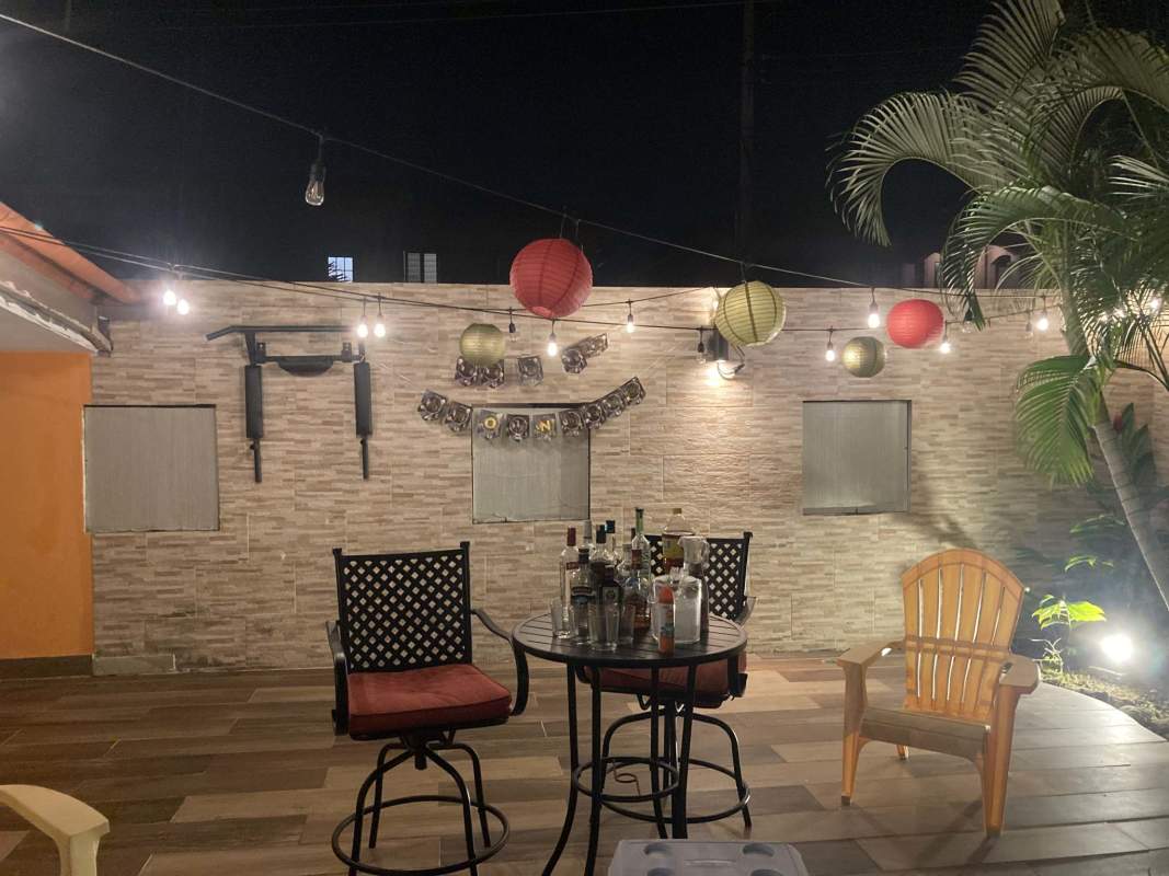 Spacious living room with gray sofas, accent wall, and AC in Versalles Urbanization Panama City