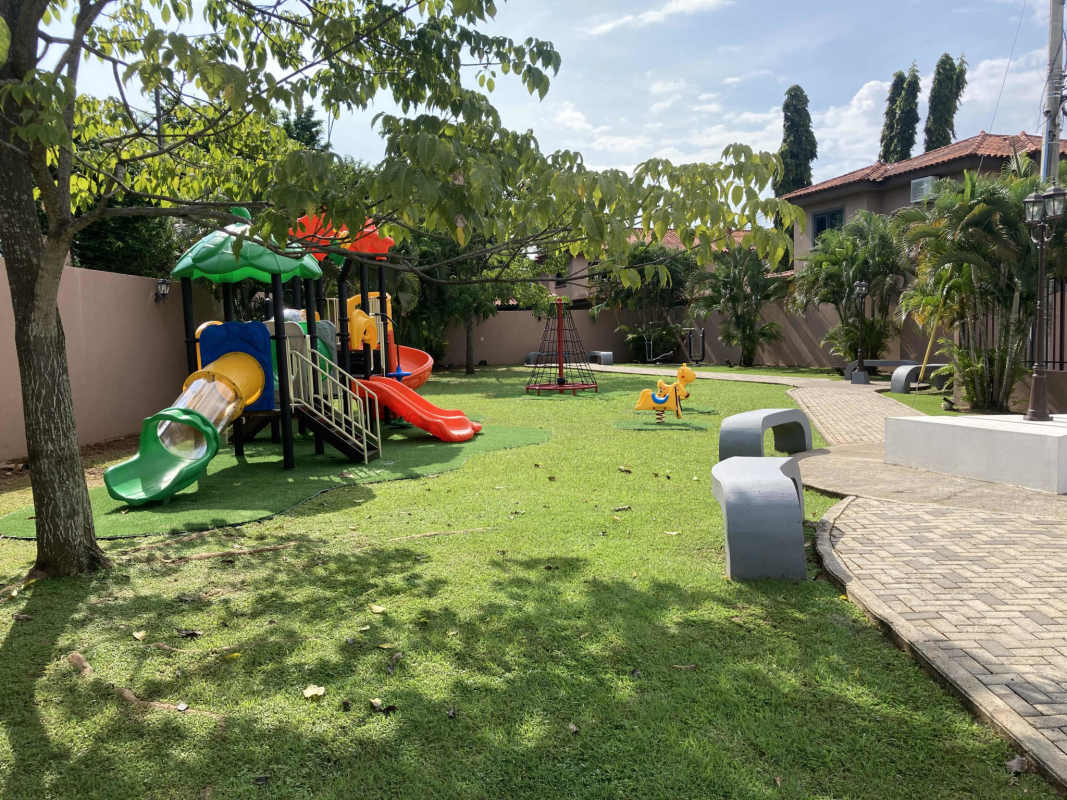Colorful playground with slides and gardens in Versalles Don Bosco Panama family community