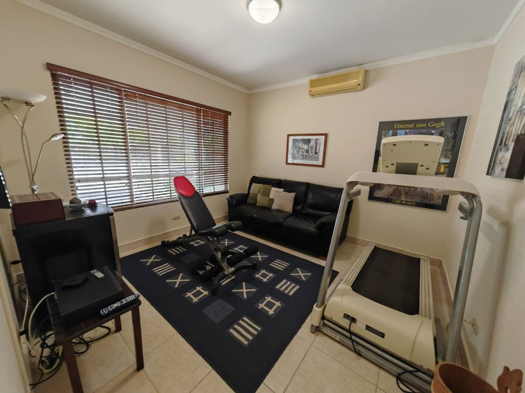 Modern living room with sectional couch and window Panama Costa Azul Costa del Este